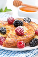 French toast with fresh berries and powdered sugar