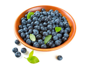 blueberries in a clay bowl