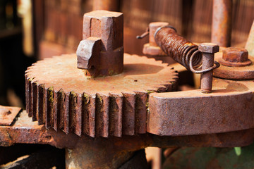 Old and rusty pinion gear of machine in factory