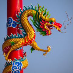 Chinese style dragon statue with blue sky
