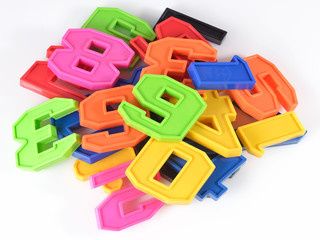 Colorful plastic numbers on a white