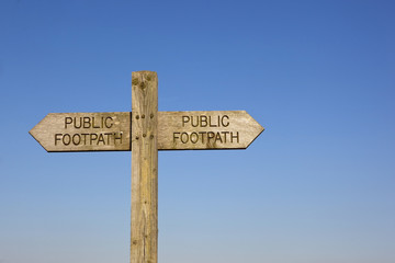 wooden public footpath sign