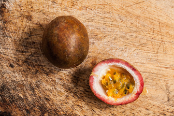 Passion fruits on wooden background.