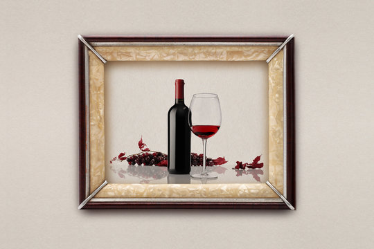 bottle and glass of wine in the frame on the wall