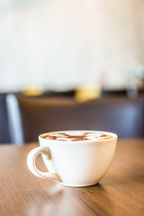Coffee cup in coffee shop interior