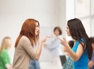 two teenagers having a fight at school