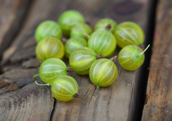 Ripe gooseberries on a wooden