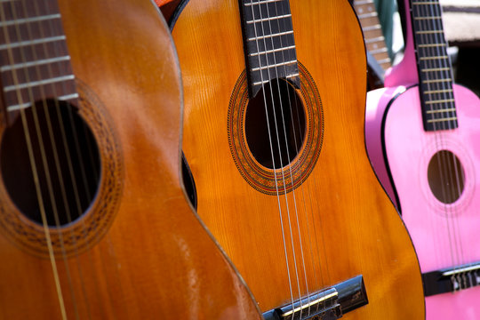 Old Wooden Acoustic Guitars on Antique Market