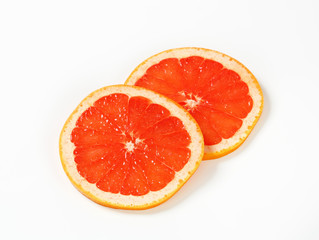 Fototapeta na wymiar Slices of red grapefruit