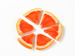 Fototapeta na wymiar Slice of red grapefruit