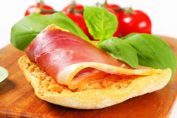 Slice of prosciutto on crispy bread