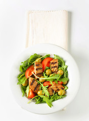 Grilled patty with fresh vegetable salad