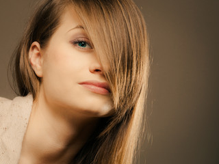 portrait of pretty girl with hair fringe covered eye