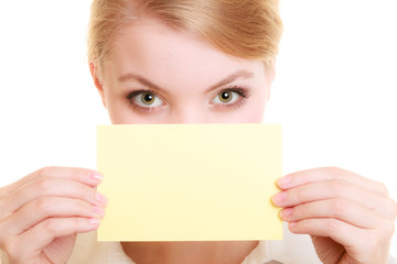 Ad. Businesswoman covering face with blank card