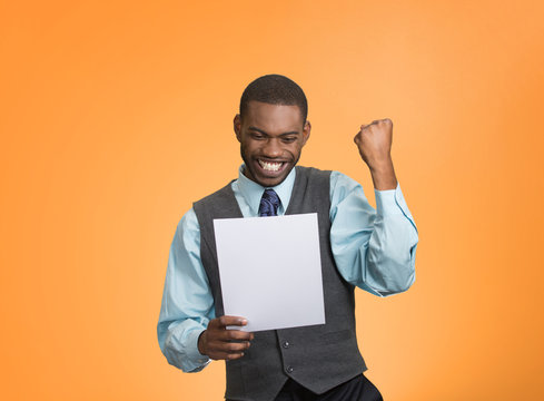 Excited happy man holding document, receiving good news