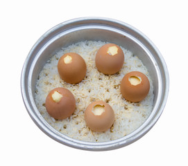 Stream Egg and rice in electric rice cooker isolated
