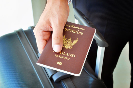 Hand holding passport