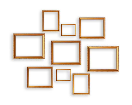 Set of golden picture frames on white background