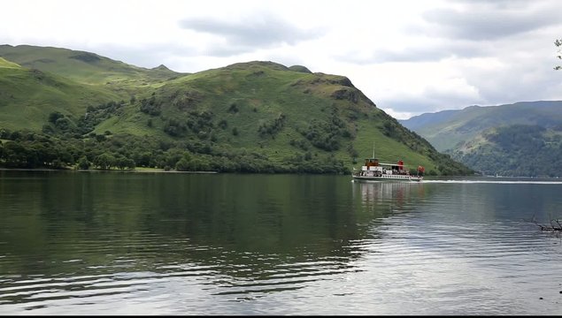 Ullswater steam ferry with mountains Lake District