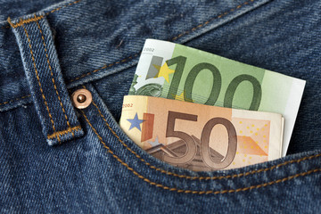 100 and 50 euro banknotes in a pocket