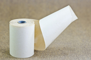 old paper rool on wood background