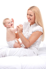 Obraz na płótnie Canvas young mum holding small baby.