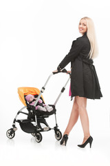 young beautiful mum with baby in stroller.