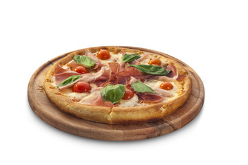pizza with ham, tomatoes and herbs on chalk board