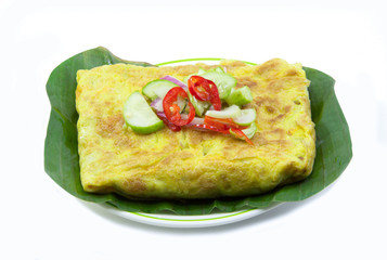 Vietnamese stuffed crispy omelet on banana leaf
