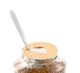 Teaspoon in a freshly opened jar of aromatic coffee
