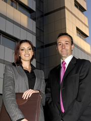 Executives close to the building and workplace.
