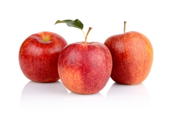Studio shot of red apples with leaf