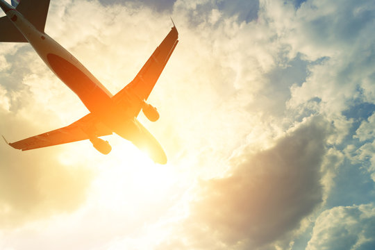 Toned photo of commercial airplane in the sun