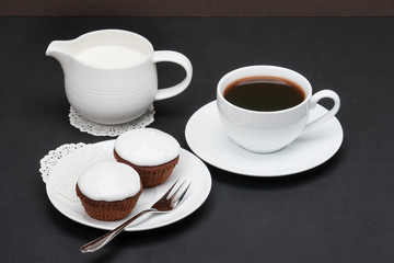 Cupcakes With Cocoa And White Cream. Coffee And Milk