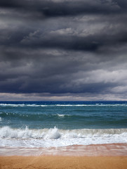 Storm clouds over blue ocean, a storm is coming