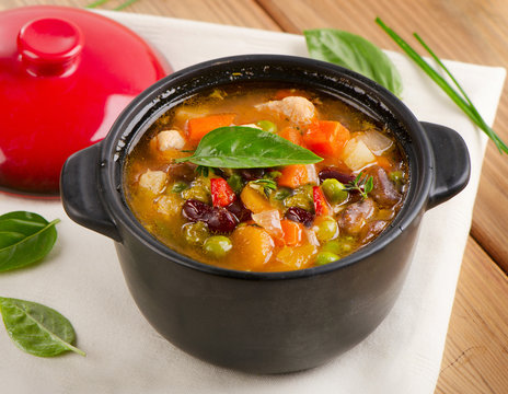 Bowl of minestrone soup  with beans and vegetables.
