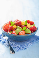 fresh fruit salad with strawberry, apple, nectarine, pomegranate