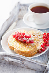 french toast with redcurrant and powder sugar for breakfast