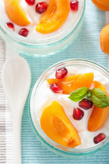 healthy breakfast with yogurt apricot pomegranate