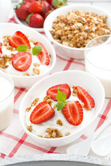 healthy breakfast - yogurt, strawberries, granola and milk