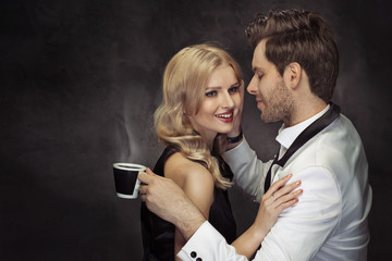 Young couple drinking coffee in the cafe