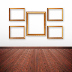 Golden picture frames on the wall inside the room