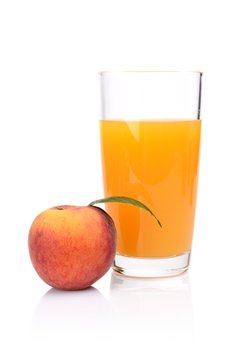 Close-up shot sliced orange peach with juice and leaf