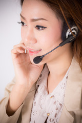 Portrait of happy smiling cheerful support phone operator in hea
