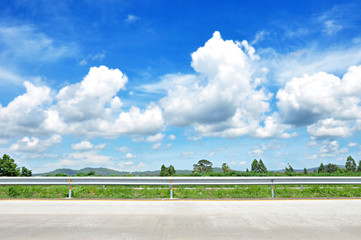 Beautiful roadside view with green hill and blue sky 