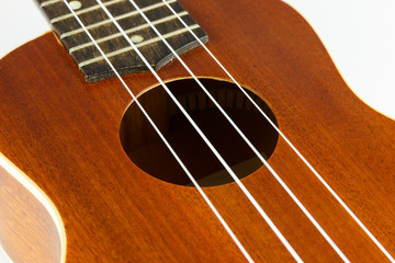 Obraz premium Body part of ukulele guitar on white background