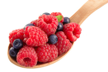 blueberry and  raspberry in spoon