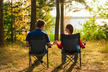 a young couple on vacation in camping