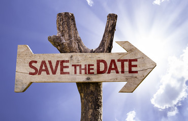 Save the Date wooden sign on a beautiful day