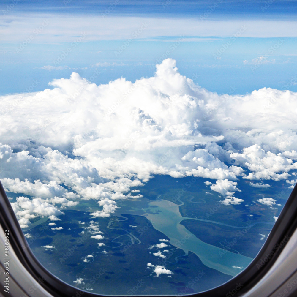 Canvas Prints aerial view of land and rivers with clouds from airplane window